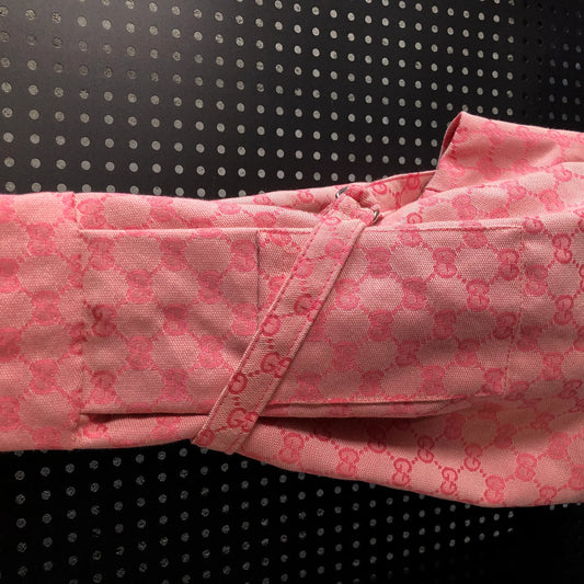 Pink fabric with a pattern on a black background