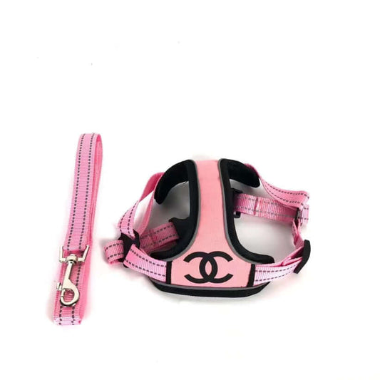 Luxury pink Chewnel dog harness and leash set designed for small dogs, featuring iconic logo.