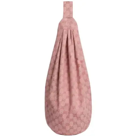 Pink baby carrier with floral pattern on a white background