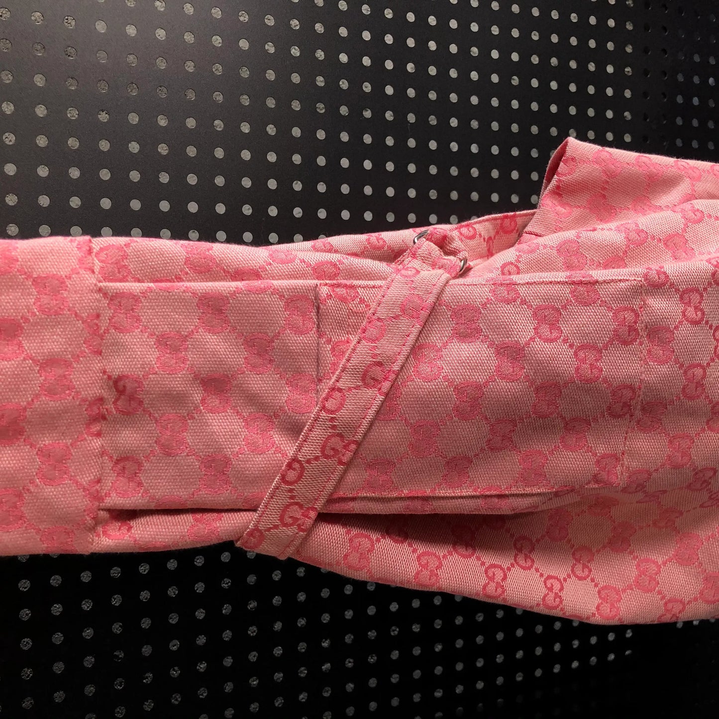 Pink fabric with a pattern on a black background